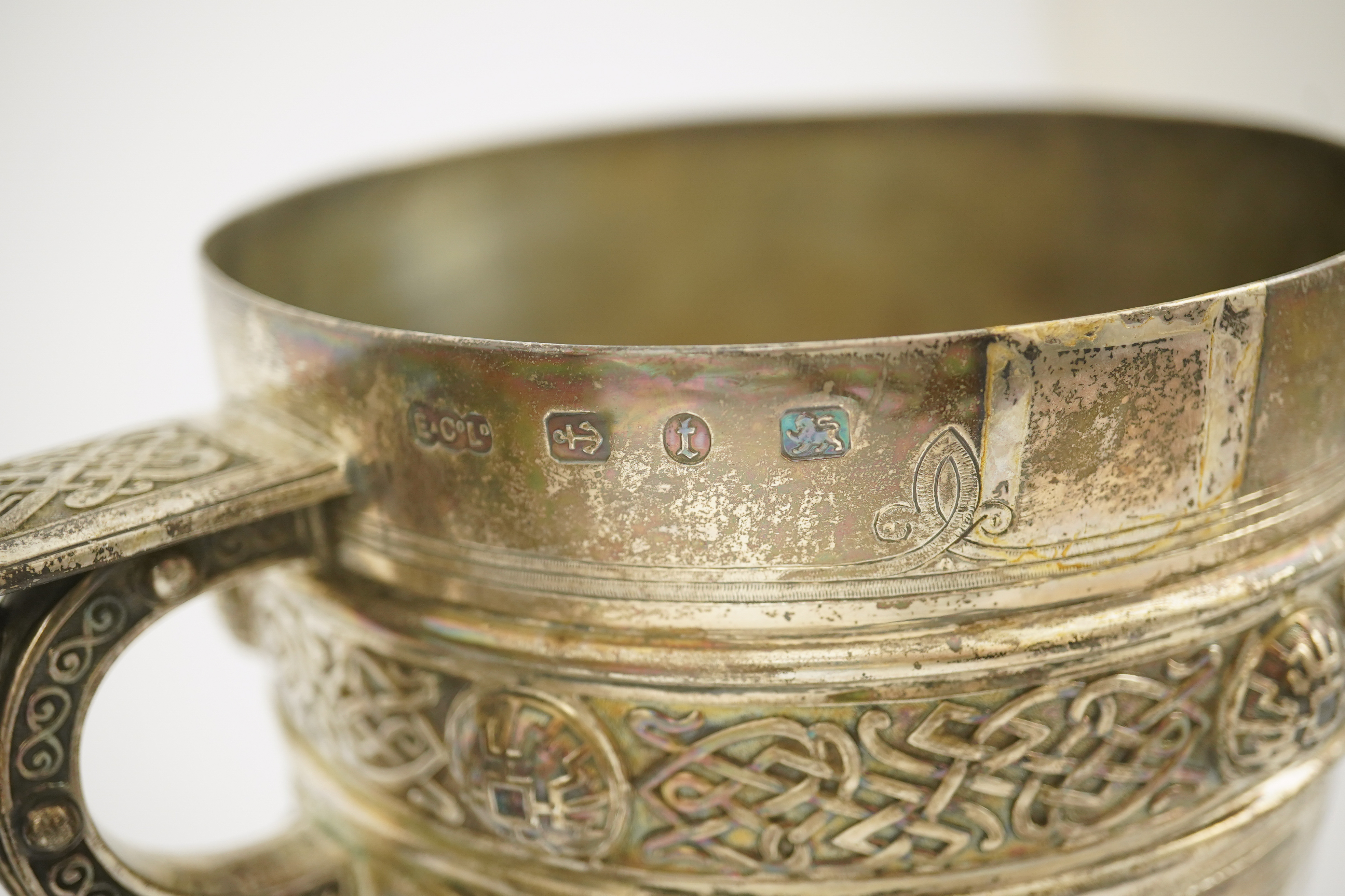 A pair of late Victorian Arts & Crafts Celtic style silver two handled presentation pedestal trophy cups, by Elkington & Co